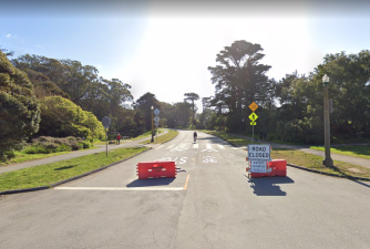 The entrance to MLK from Chain of Lakes in April. Barriers now gone and cars back. Image: Google maps