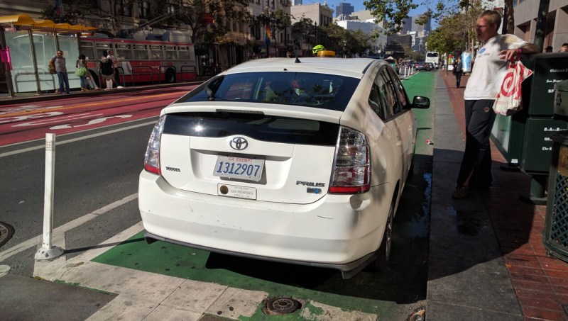 A photo from 2016 of a San Francisco City employee blocking the bike lane on Market Street. Recently released data shows city officials in city cars routinely drive recklessly and otherwise put the public in danger. Photo: Streetsblog/Rudick