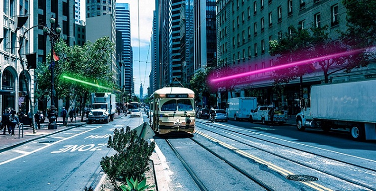 Purple light shows a Muni subway heading inbound, while an M or (a Daly City BART train?) heads outbound...somewhere below. Image: Illuminate