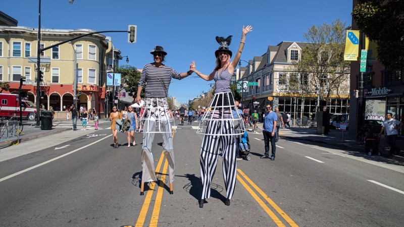 Some unusually tall people enjoyed strolling down Valencia during yesterday's Sunday Streets event in the Mission. Photo: Streetsblog/Rudick