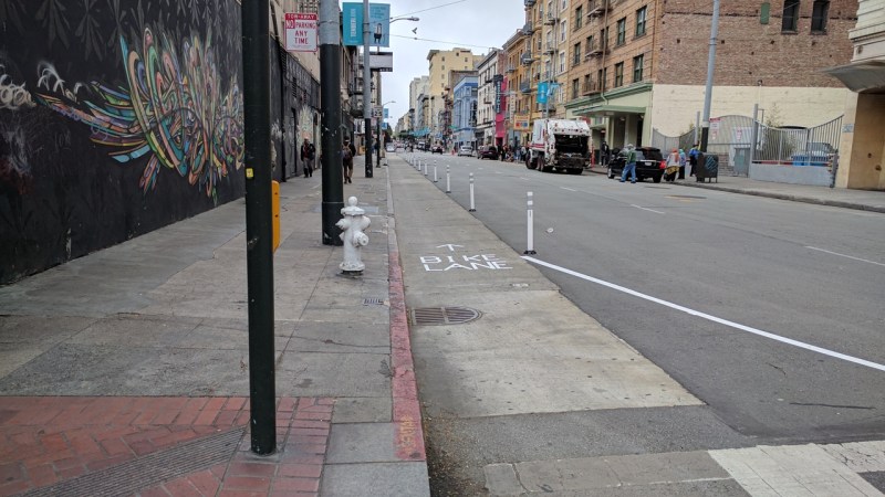 SF Transformation has installed about 200 feet of bollard protected bike lane on Turk near Market. Photo: Streetsblog/Rudick