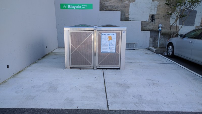 Until a few weeks ago, these two bike lockers were hidden away at the back of a municipal parking lot near West Portal Station. And now they're gone. Photos by Streetsblog/Rudick