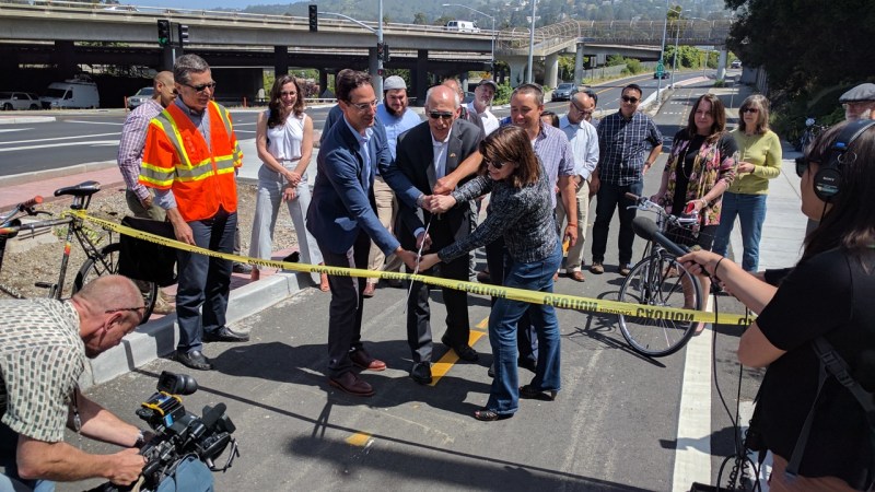 Ryan Russo, Dan Kalb, Renee Rivera and Ann Smulka cut the ribbon on Oakland's first concrete -protected bike lane. Photo Streetsblog/Rudick