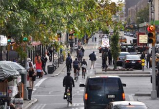 Russo remembers seeing a mother and daughter cycling on the Ninth Avenue protected bike lane soon after it debuted in 2007: "The idea that someone who's seven or eight years old would ride their own bicycle on an avenue in Manhattan -- it was an outlandish concept. The fact that someone had done that made me realize people were going to respond to this." Photo: NACTO