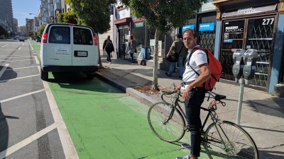Mark Sloothaak, an urban transportation planner with the City of Amsterdam, says that even parking protected bike lanes need a curb to prevent cars from getting into the bike space. All photos Streetsblog/Rudick unless otherwise indicated