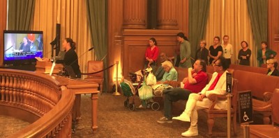 SFBC's Janelle Wong at the front of a line of advocates who urged the Board of Supervisors to reject any more delays to protected bike lanes on Upper Market. Photo: SFBC