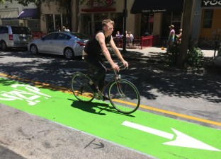 Cyclist on Santa Cruz' one-way contraflow Pacific Avenue bike lane. All photos by Joe Linton/Streetsblog L.A.