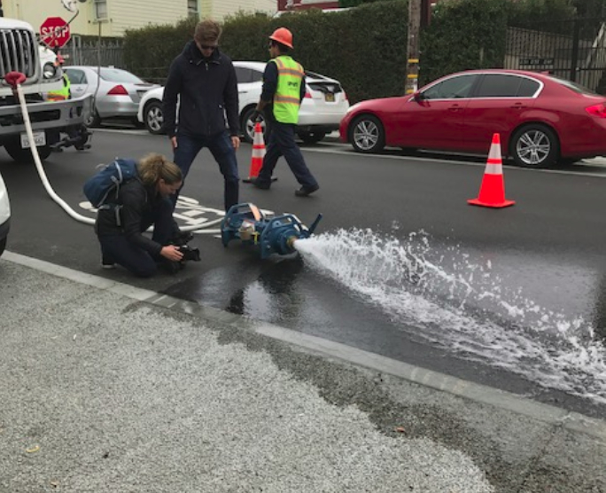 The city pumped some storm water onto the street to test the drainage and permeable surface. It worked perfectly and the water was drawn away immediately. Photo: SFPUC. All other photos Streetsblog/Rudick