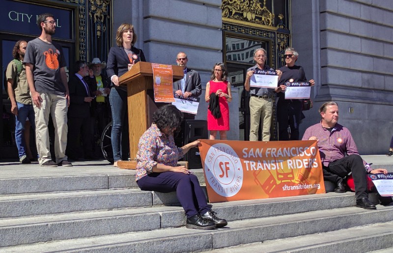 Flanked by transit-riding volunteers, lawmakers and officials, Rachel Hyden kicked off Transit Week. Photo: Streetsblog/Rudick