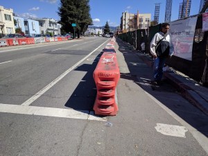 Policy makers say they want protected bike lanes to be the new normal, but street-level workers aren't getting the memo, as seen at MacArthur BART. Photo: Streetsblog/Rudick