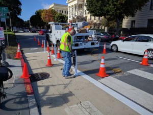 An SFMTA worker installing safe-hit posts at Baker and Fell late this morning. All photos Streetsblog/Rudick unless otherwise noted.