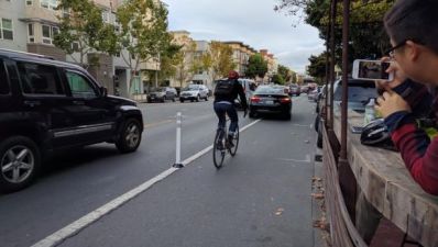 An Uber blocking the bike lane on Valencia. Photo: Streetsblog/Rudick