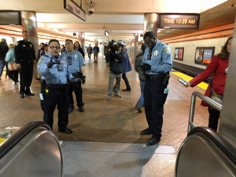 Fare inspectors at the bottom of the Powell Station escalator. Photo: Streetsblog/Rudick