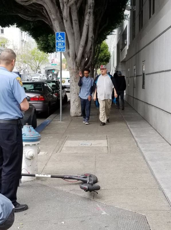 A scooter blocking the sidewalk at Hyde and Grove. Photo: from Walk SF's "Scooters Behaving Badly" album.