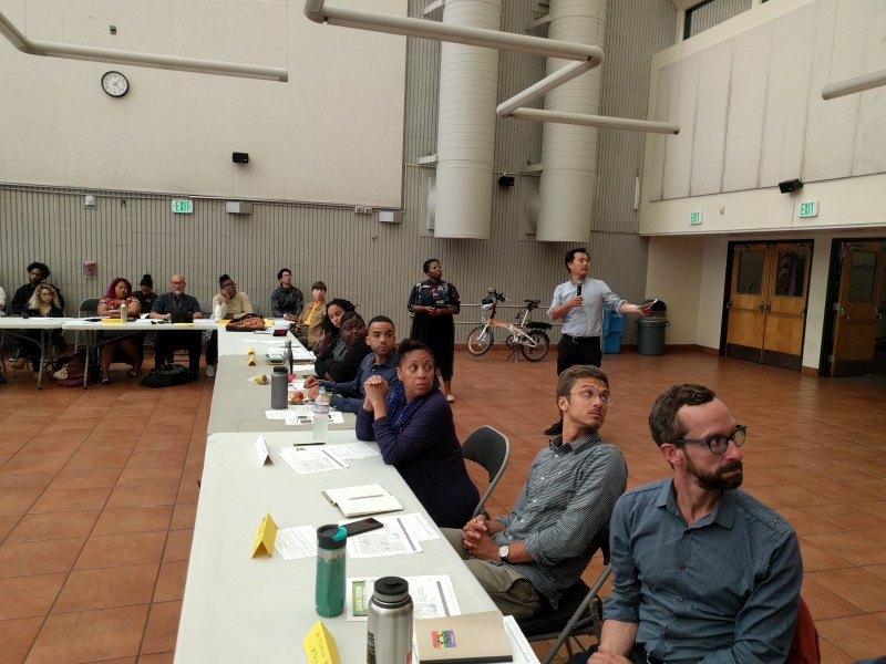 SFMTA's Ariel Ward and Adrian Leung talk about Ford GoBikes with BMAGIC. That's SFBC's Christopher White in the lower right. All photos Streetsblog/Rudick unless indicated