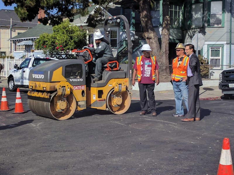 Ryan Russo, head of Oakland DOT, consults with a crew steam-rolling new asphalt on 16th Street in Fruitvale. All photos Streetsblog/Rudick unless indicated