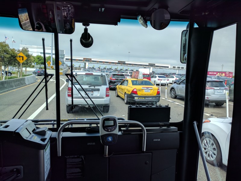 Why is a bus full of people forced to wait behind single-occupancy cars? Photo: Steetsblog/Rudick