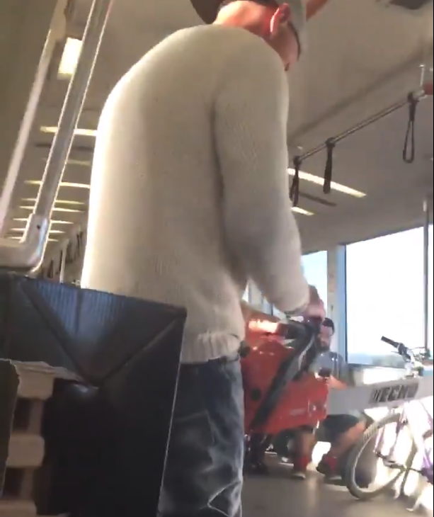 A man brandishing a chainsaw on BART. Image captured from Twitter