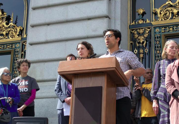 Eva Orbuch and Sasan Saadat, friends of Tess Rothstein, were among those who demanded protected bike lanes today at City Hall. Photos: Streetsblog/Rudick