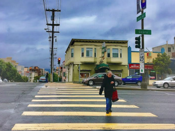 A senior does her best to safely cross Geary. Photo: Winston Parsons
