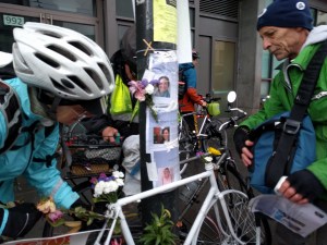Cyclists adorn Tess Rothstein's ghost bike and remember Amelie Le Moullac and Kate Slattery and others who have fallen. Photo: Streetsblog/Rudick