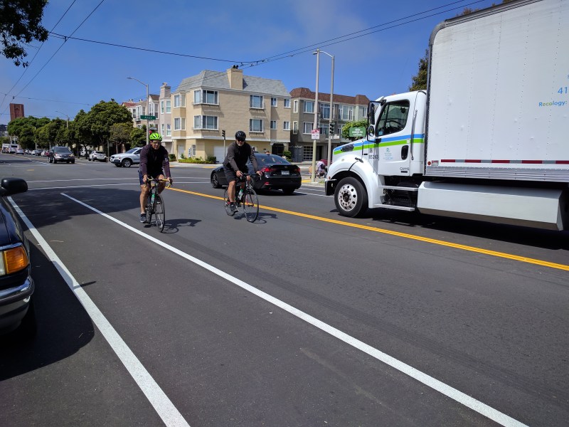 Cyclists turning from Anza onto Arguello contend with speeding traffic and unsafe door-death bike lanes. All photos Streetsblog/Rudick