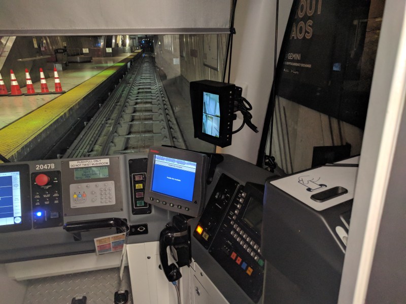 Muni train operators report that the look-back screens (seen top right, there's another out of view to the left) are prone to freezing, "white out" if they catch glare, and have blind spots. Photos: Streetsblog/Rudick