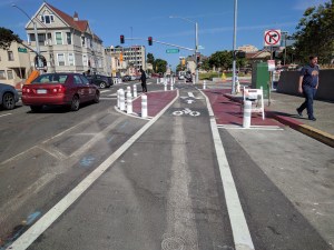 One of Oakland's new low-cost protected intersections around Lake Merritt BART, complete now with K71 bollards. Bollards keep people from parking on the corner AND make it safer for cyclists