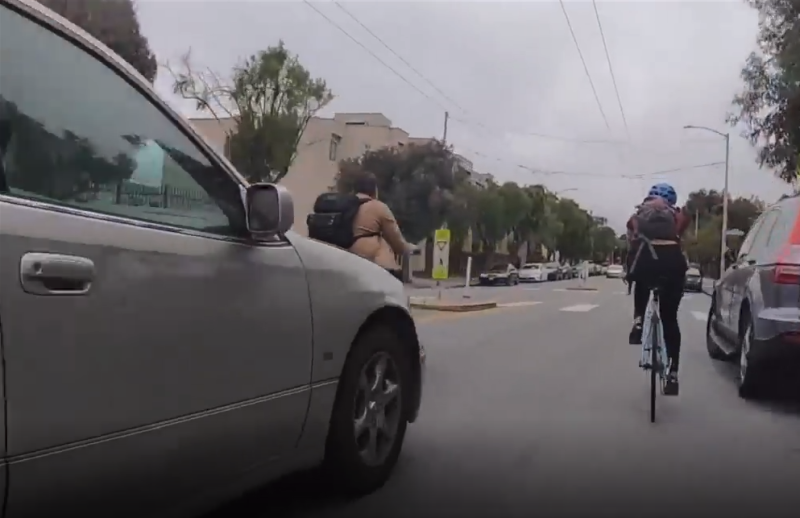A still from a video of a motorist just before they ran into the cyclist on the left