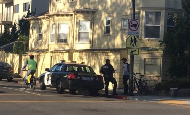 Berkeley PD ticket a bicyclist on Milvia. Photo by Liza Lutzker