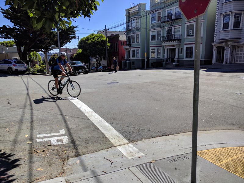 On Thursday afternoon, a cyclist and motorist collided at this intersection in the Castro (the cyclist would have been traveling in the opposite direction as the one in the picture above). Photo: Streetsblog/Rudick