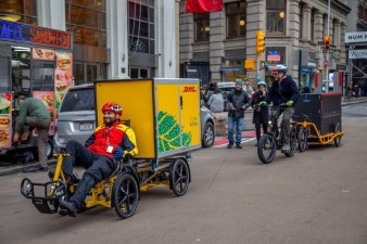 DHL field supervisor Jose Polanco (left) and Streetsblog Editor Gersh Kuntzman show off the future of package delivery in New York City. Photo: DOT