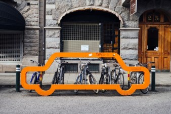 Malmo, Sweden, is home to some of the most effective sustainable transport campaigns; above, an installation shows how bikes make far more efficient use of limited street space than cars do. Source: Unsplash/Susan Yin.
