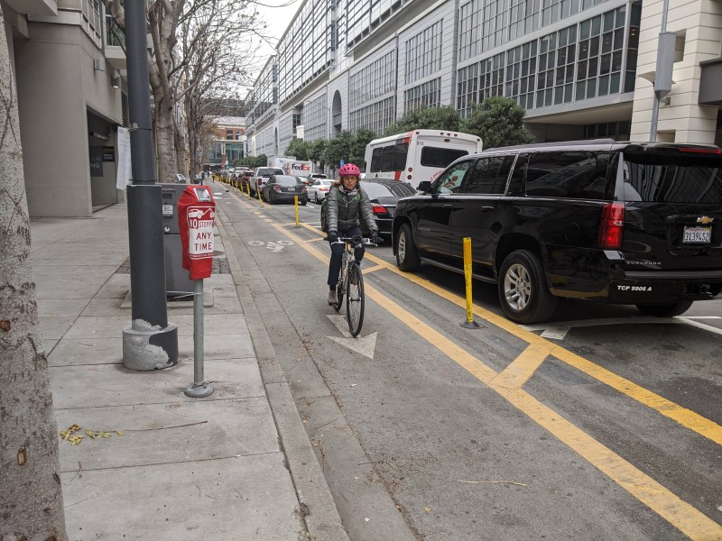 A cyclist using the Berry contraflow bike lane. Crowd sourced data is helping identify hot spots of bike lane abuse. Photo: Streetsblog/Rudick unless noted