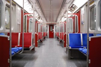 We're in for a lot of empty trains — and economic catastrophe — if we don't get a better relief bill soon. Image description: An empty train car with blue and red seats. Source Creative commons