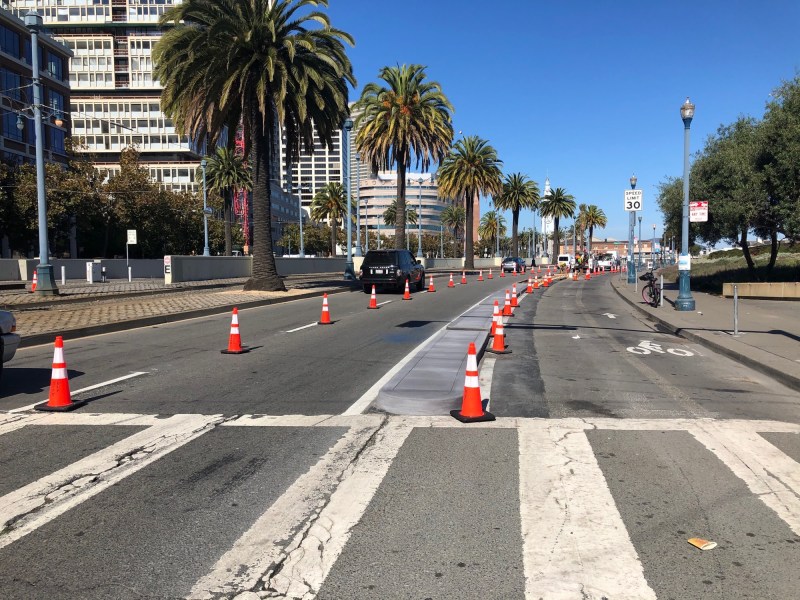 A brand new concrete curb protected bike lane on the Embarcadero. Photo: SFMTA