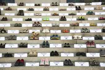 Shoes on the steps of City Hall mark those lost to traffic violence. Photo: William McLeod