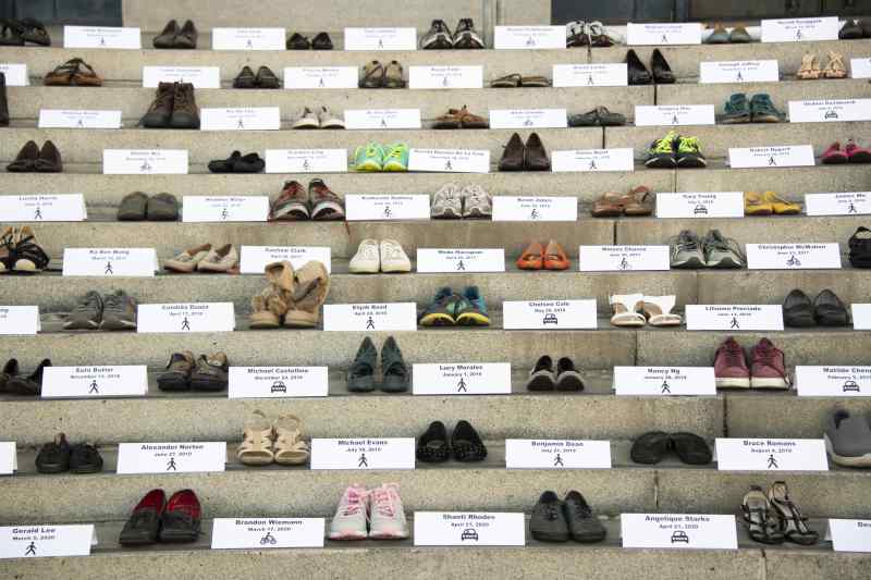 Shoes on the steps of City Hall mark those lost to traffic violence. Photo: William McLeod