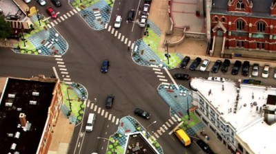 Aerial photo of the Lincoln Hub at Wellington/Southport/Lincoln in Lakeview by traffic reporter Sarah Jindra. Paint-and-post bump-outs made it easier to cross the street, calmed traffic, and created new seating areas.