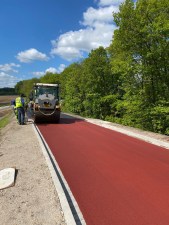 Colored asphalt for a bike path getting applied in Munich. Photo from the "Coloured Asphalt" website