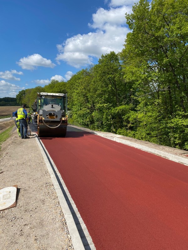 Colored asphalt for a bike path getting applied in Munich. Photo from the "Coloured Asphalt" website