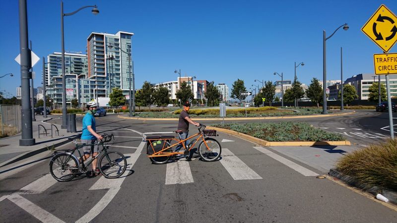 Cyclists walking across the squirrely roundabout in Mission Bay. Photo: Nik Kaestner