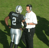 Greg Knapp coaches JaMarcus Russell of the Oakland Raiders. Image: BrokenSphere, CC