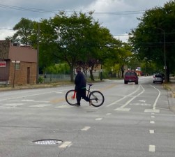 A person with a bike in Chicago's Roseland community. In recent years the city has been building more bikeways on the Far South Side, but the density of bikeways is still much greater in most of the North Side. Photo: John Greenfield