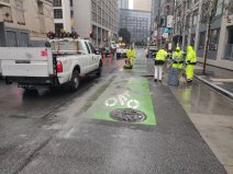 Crews removing the current "mixing zone" near where a pedestrian was killed in May. Photo: SFMTA