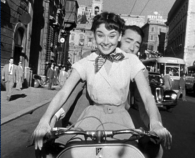 Audrey and Gregory demonstrate a different way to enjoy a gas tax holiday. Image from Roman Holiday