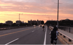 Bike traffic on the Massachusetts Avenue bridge heading towards Cambridge on the evening of August 4, 2021.