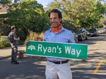 Ryan Russo displaying a going-away gift at his farewell party--a street party of course. Photo: Streetsblog/Rudick