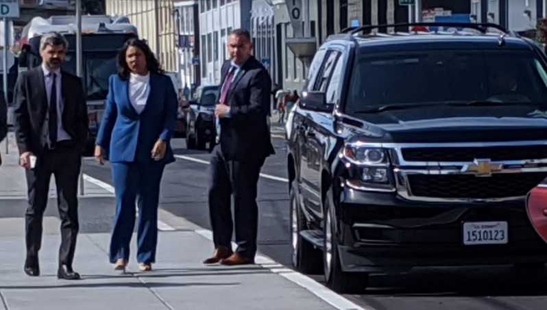Mayor London Breed arriving via SUV to a ceremony to dedicate a new bike lane on Townsend in 2020. Photo: Streetsblog/Rudick