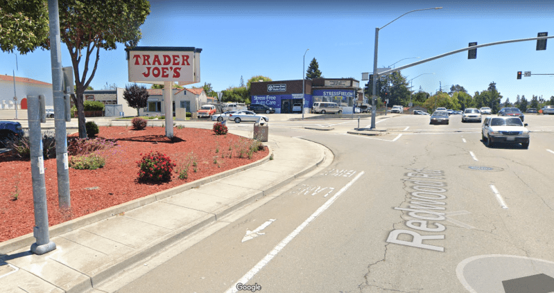 Redwood Road, where a motorist slammed into people *inside* this Trader Joe's. Yet cyclists are given a bike lane that crosses slip turns, along a six lane stroad in this grotesque example of how not to make people safe. Image: Google Maps